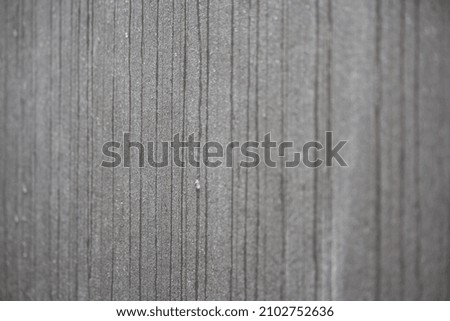 a wet concrete wall with drops