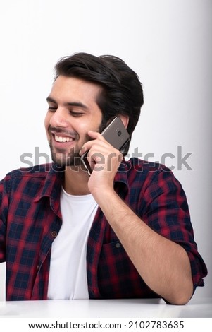 Young man talking on phone stock photo
