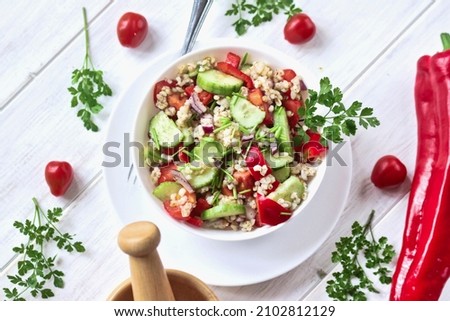 Bulgur salad. salad with fresh vegetables and groats. A quick and light meal. Royalty-Free Stock Photo #2102812129