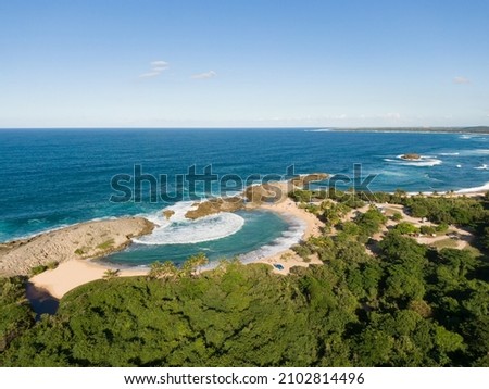 A beautiful aerial picture of a beach with a form of a shell on a sunny day - Mar Chiquita