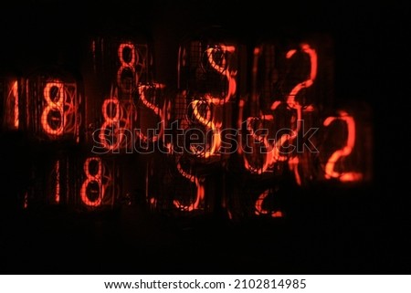 Red numbers on gas discharge indicators Royalty-Free Stock Photo #2102814985