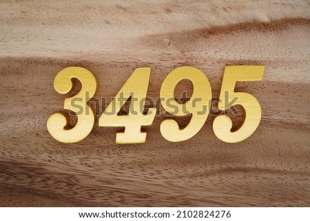 Golden Arabic numerals 3495 on a dark brown to white wood grain background.