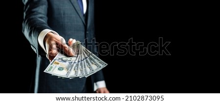 Dollar sign. Rich businessman holding american money. Cash usd bill background