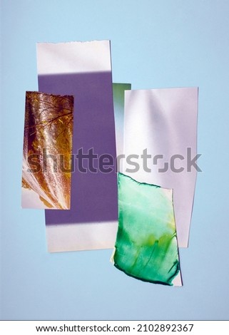 Illustration of modern collage art. A composition of scraps of paper, pictures and photographs on a pale blue background.