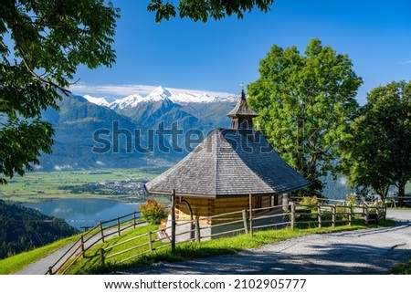 Small mountain chapel in Zell am See, in the background the impressive snow-covered Kitzsteinhorn, Salzburg, Austria, Europe Royalty-Free Stock Photo #2102905777