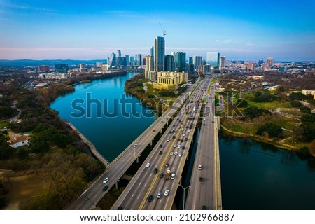 Austin Texas USA a gorgeous capital City of Texas aerial drone views above Coloradp River and Interstate 35 and tall skyscrapers growing Cityscape  Royalty-Free Stock Photo #2102966887