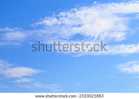 Beautiful blue cloudy sky in windy weather. Background or blank for design.