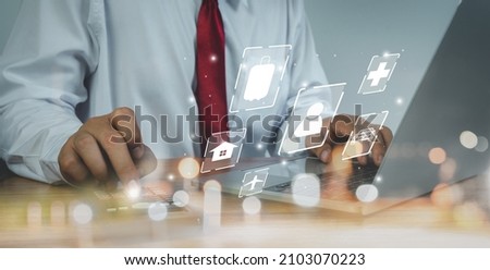 Close up business man calculate expense monthly with banking life insurance home loan travelling credit card annual savings money heath care costs growth up chart. Financial and spending payment. Royalty-Free Stock Photo #2103070223
