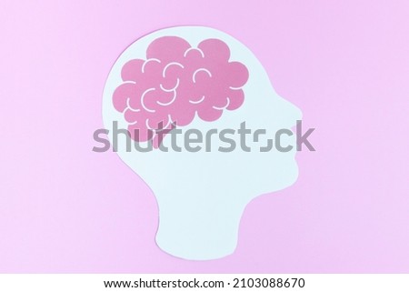 Human head with brains on Pink background. Concept of idea and neurology, biology.