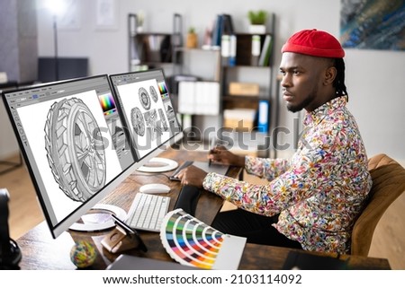 African Graphic Web Designer Using Design Editing Software