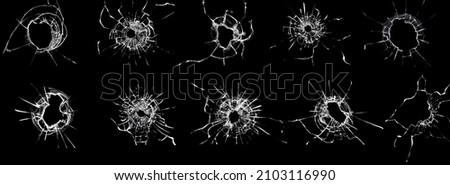 Set of cracked and chipped broken glass on black background. Abstract collage with cracked window texture. Broken glass effect for design Royalty-Free Stock Photo #2103116990