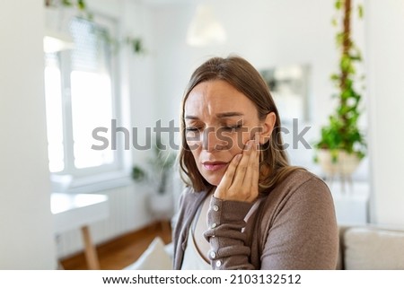 Tooth Pain And Dentistry. Young Woman Suffering From Terrible Strong Teeth Pain, Touching Cheek With Hand. Female Feeling Painful Toothache. Dental Care And Health Concept. Royalty-Free Stock Photo #2103132512