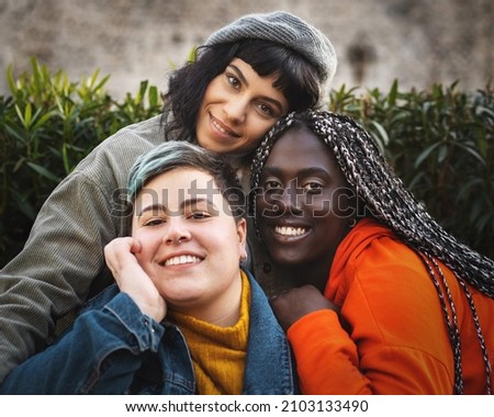 Portrait of multiracial diverse young woman smiling and looking at the camera Royalty-Free Stock Photo #2103133490