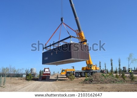modular house, lifting module, container, crane, lift, metal, prefabricated, modular home, vehicle, construction, containerized Royalty-Free Stock Photo #2103162647