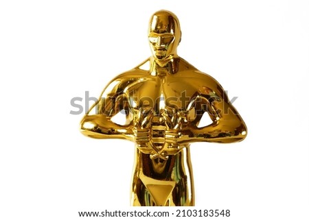 Hollywood Golden Oscar Academy award statue on white background. Success and victory concept.
