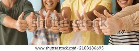 Diverse group of happy people giving thumbs up. Cheerful optimistic multiethnic multicultural men and women showing positive thumbs up gestures together. Human hands, close up, cropped shot, banner