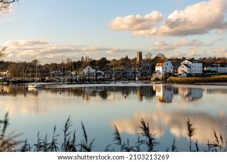 Woodbridge Tide Mill in Woodbridge, Suffolk, on the banks of the River Deben, England. A rare example of a tide mill were the water wheel still turns Royalty-Free Stock Photo #2103213269