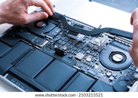 Pc repair service. Computer technician service with laptop on hardware technology background. Maintenance engineer support. Engineer fixing broken computer motherboard Royalty-Free Stock Photo #2103213521