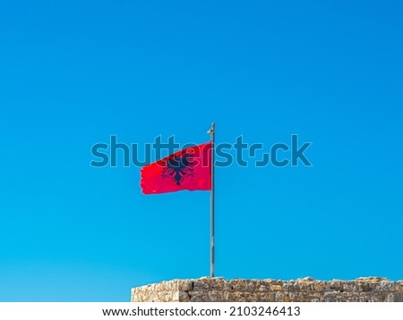 Albanian flag on blue sky