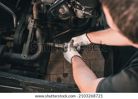 The mechanic go kart racing service pours fuel into the tank Royalty-Free Stock Photo #2103268721