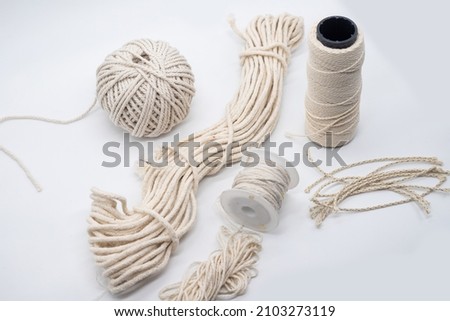 Isolated photos of cotton eco wicks for candles Royalty-Free Stock Photo #2103273119