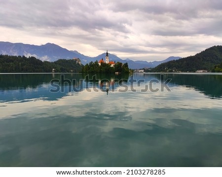 Beautiful landscape with lake, island and tower