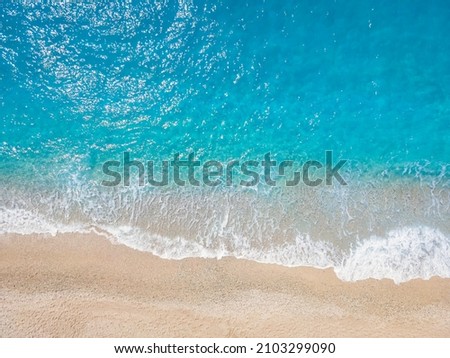 A background or texture of turquoise sea and waves at a beach
