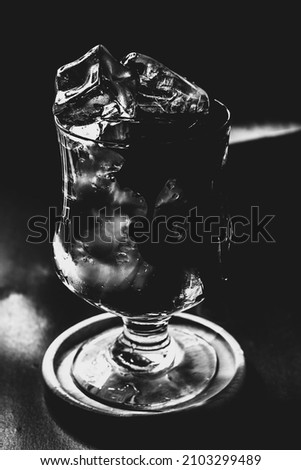 black and white photo of a glass of water
