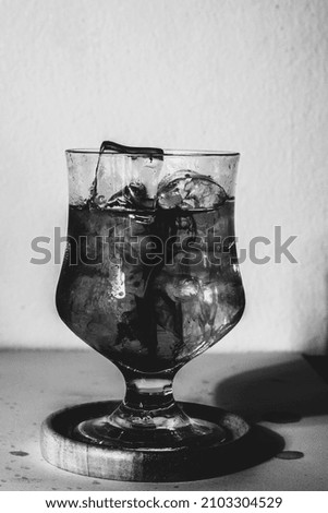 black and white photo of a glass of water