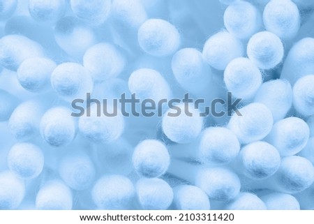 Macro shot set of cotton buds. Cotton buds background. White soft cotton swabs for make up or cosmetics and ear cleaning. Medical plastic sticks signs
