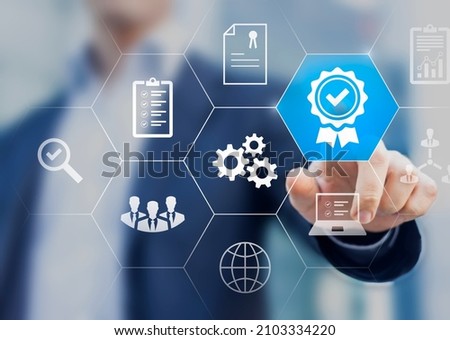 Certification and standardization process, iso certified business, conformity to international standards and quality assurance concept. Person touching certificate icon. Royalty-Free Stock Photo #2103334220