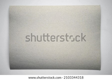 Photo of a white cardboard sheet of paper on a white isolate.
