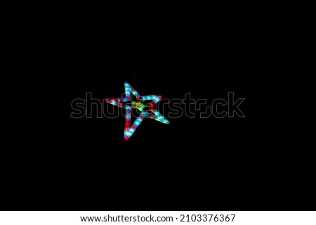 Christian Christmas star with luminous color full lights on at dark night