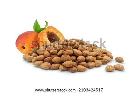 Apricot kernels and juicy fruit isolated on white background Royalty-Free Stock Photo #2103424517