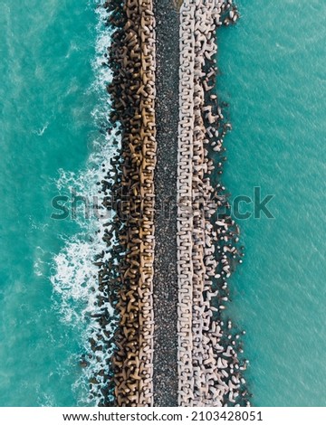 Aerial photo of a breakwater facing the sea in Tuxpan Veracruz Mexico Royalty-Free Stock Photo #2103428051