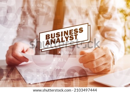 Business analyst, businessman analyzing company reports, digitally enhanced image with selective focus