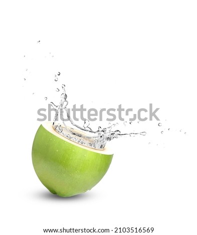 Green coconut with coconut water (juice) splash isolated on white background.