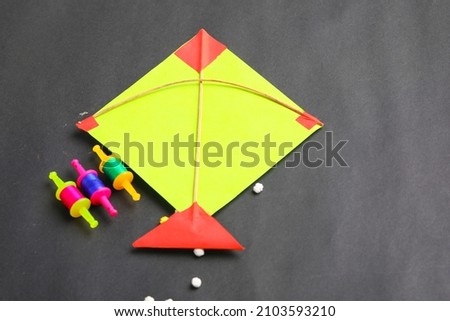 Colorful paper kites and string , Makar Sankranti festival Concept.