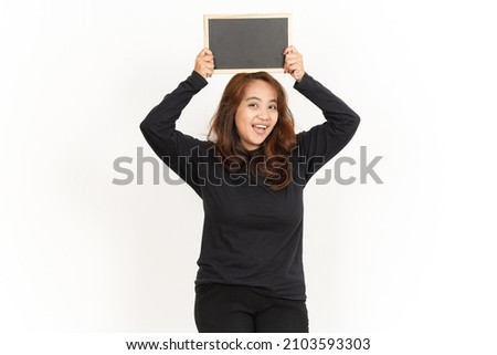 Showing, Presenting and holding Blank Blackboard Of Beautiful Asian Woman Wearing Black Shirt Isolated On White Background