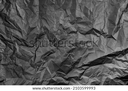 black paper textures and backgrounds. Surface of crumpled black paper.
