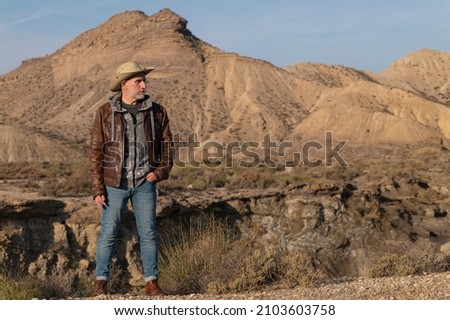 Adult man in cowboy hat in Tabernas Desert, Almeria, Spain