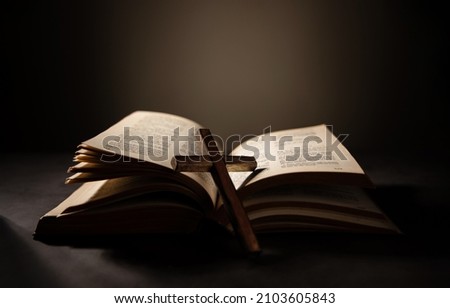 Spirituality, Religion and Hope Concept. Holy Bible and Cross on Desk. Symbol of Humility, Supplication,Believe and Faith for Christian People Royalty-Free Stock Photo #2103605843