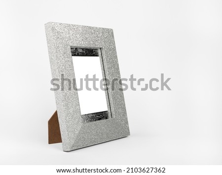 Blank shining silver picture frame with clipping path on white background.