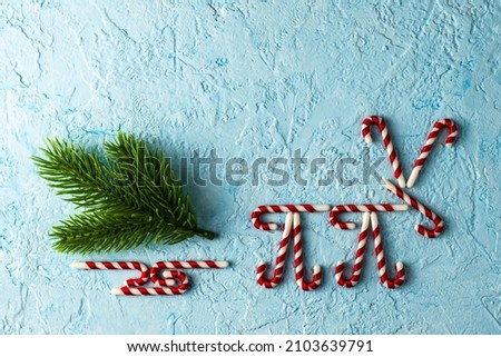 a deer lined with New Year's caramel carrying a sleigh with a fir branch on a blue background. High quality photo