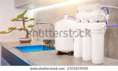 water filtration system. Home water purification filter. High quality photo Royalty-Free Stock Photo #2103659420