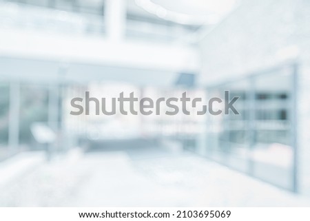 BLURRED BUSINESS OFFICE BACKGROUND, MODERN COMMERCIAL HALL, SPACIOUS HALL INTERIOR, HEALTH CARE CENTER, CLINICAL BUILDING  Royalty-Free Stock Photo #2103695069
