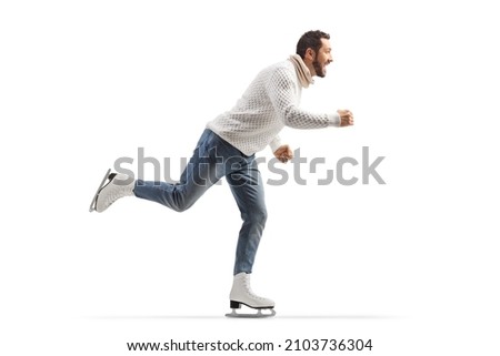 Full length profile shot of a young man ice skating isolated on white background