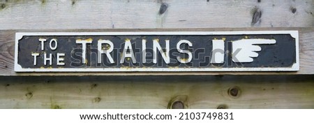 Vintage British To The Trains Sign at a railway station