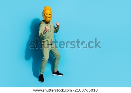 Photo of self-assured boxer guy hold fists wear gorilla mask sportswear sneakers isolated blue color background