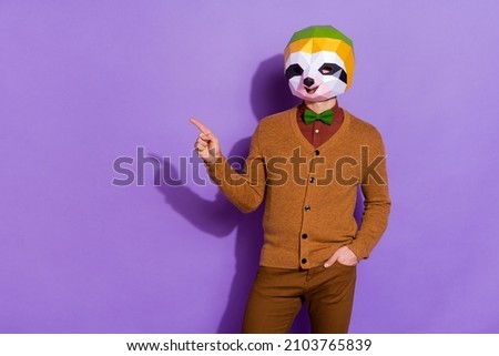 Photo of young guy indicate finger empty space ads promo recommend isolated over purple color background